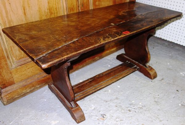 A 19th century elm topped rectangular low table on trestle style, supports 90cm wide.