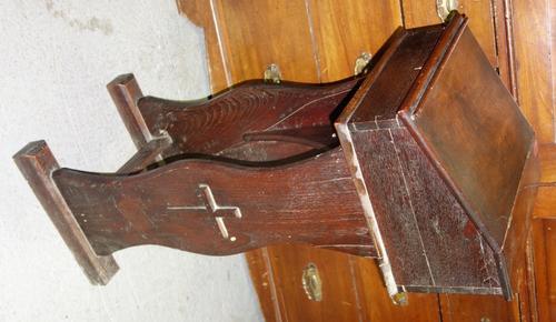 An oak lift top lectern of small proportions on trestle type base with applied cross motifs, 36cm wide.