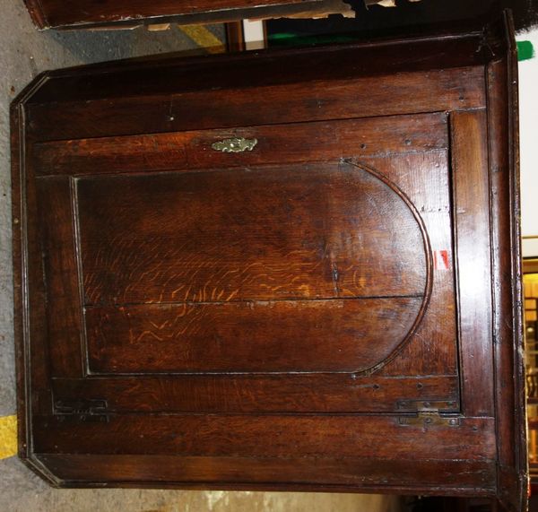 A 19th century oak corner cupboard with arched panel door, 90cm wide.