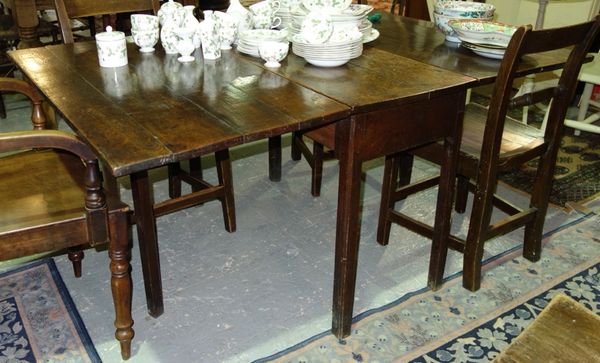 An 18th century oak drop flap dining table 101cm wide.