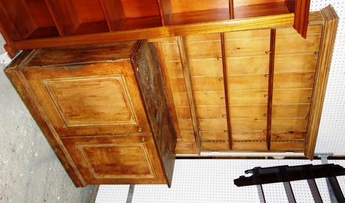 A 19th century pine dresser, with three tier plate rack over the base with pair of panelled cupboard doors, 122cm wide.