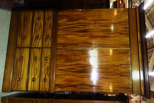 A large 20th century mahogany wardrobe with pair of ebony inlaid doors over the base with two banks of three short drawers, 158cm wide.