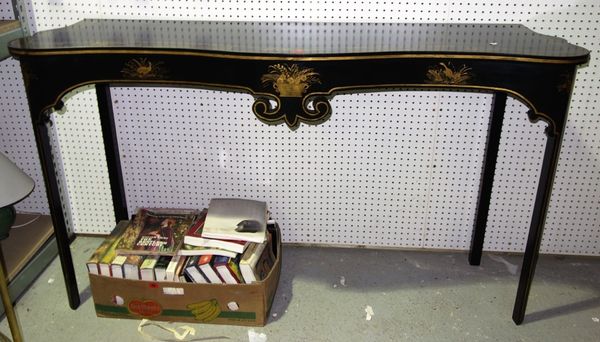 A large 20th century ebonised and gilt decorated serpentine console table, 185cm wide.