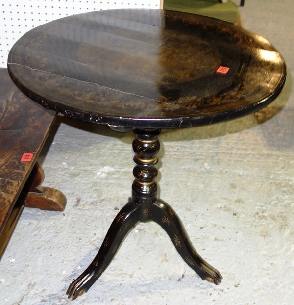 A 19th century black lacquer chinoiserie decorated circular tripod table 63cm wide.