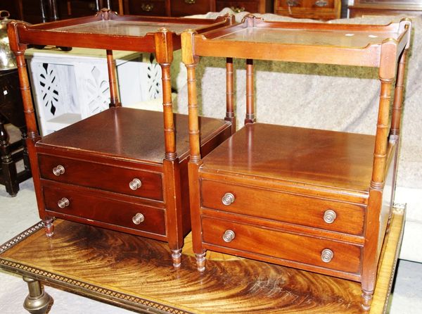 A pair of 20th century mahogany two tier occasional tables, each with pair of drawers, 48cm wide. (2)