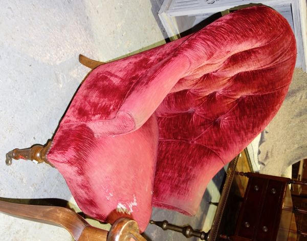 A walnut framed red button upholstered nursing chair.