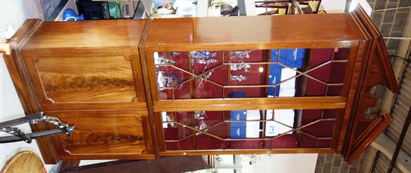 A pair of 20th century large mahogany bookcases, each with astragal glazed top section over cupboard base, 131cm wide.