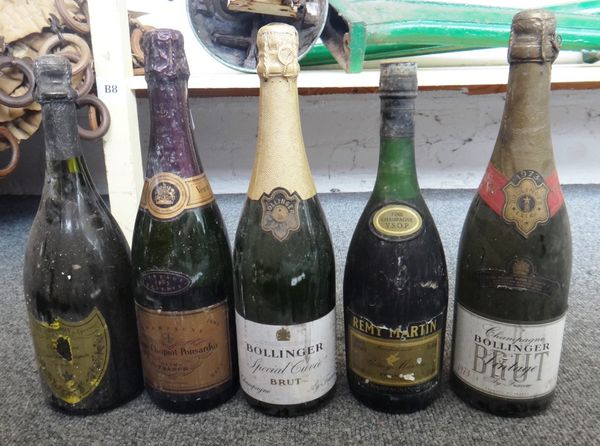 A Moet & Chandon Dom Perignon 1973 vintage champagne, a Moet & Chandon magnum of champagne, a Veuve Cliquot Ponsardin 1985 vintage champagne, two bott