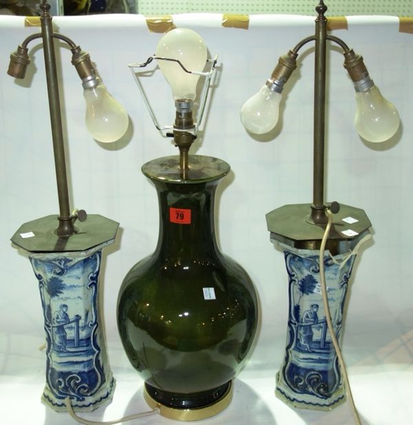 A pair of blue and white Delft vases converted to lamps, together with an Oriental style green ceramic baluster vase converted to a lamp. (3)