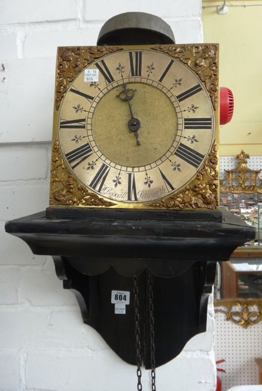 An early 18th century thirty hour brass bracket clock, W Boxall Petworth, the 8" brass dial with female mask spandrels around silvered chapter ring, s