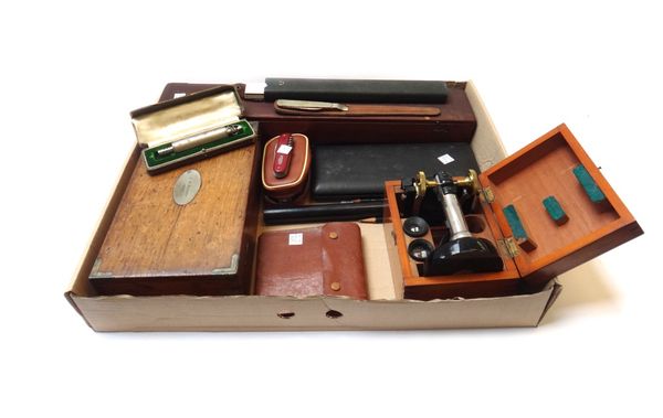 An engineer's drawing set housed in a fitted oak case and dated 1886, together with a student's microscope by G. Baker in a fitted mahogany case, a ro