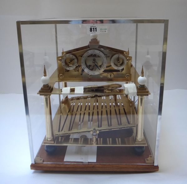 A reproduction William Congreve rolling ball clock, built circa 1980 by William R. Smith, Stanwick St John, with polished brass finish on a mahogany p