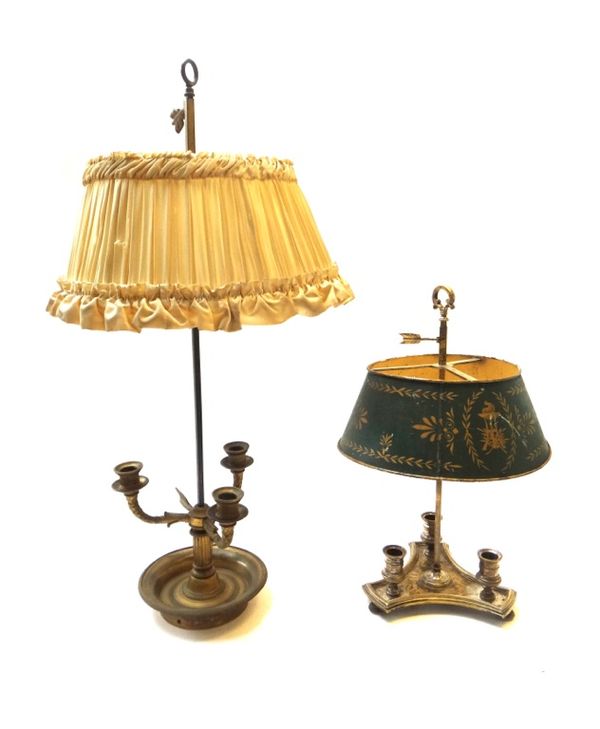 Two Empire style French brass bouillotte lamps, early 20th century, both with adjustable shades, one pleated  and ruffled cream fabric, the other gree