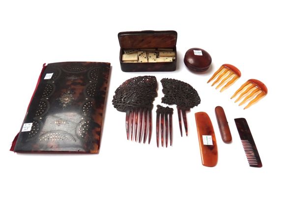 A tortoiseshell and brass box with hinged lid, a pair of blonde tortoiseshell combs, an Indian comb, an inlaid needle case, a circular patch box, a to