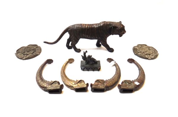 A 19th century bronze depicting a hunting hound seated next to a brace of game birds, 11cm high, a modern bronze tiger, 52cm wide, two bronze Tudor ro