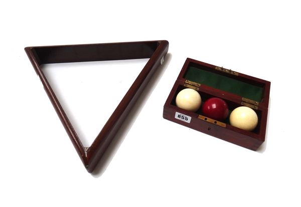 A set of three Edwardian ivory billiard balls in a mahogany case, and a mahogany snooker triangle.