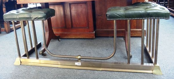 A Victorian style gilt metal and green leatherette upholstered adjustable club fender, 51cm high.