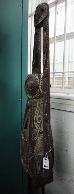 A Polynesian carved wood pierced sculpture on stand, with polychrome decoration, 182cm high.