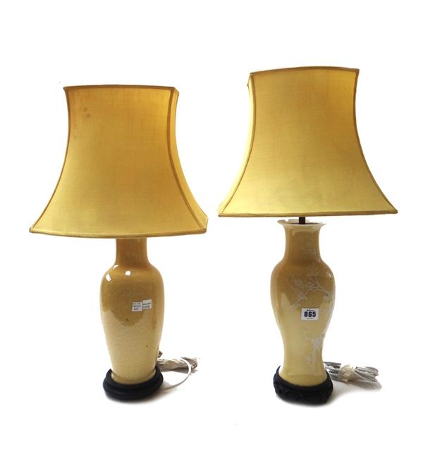 Two similar Chinese style pottery vase table lamps, with yellow ground decorated with birds amongst prunus, together with a further pair of modern oct