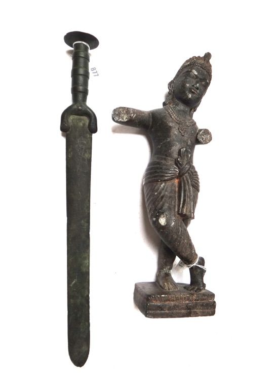 A reproduction short sword of Romanesque European form, 57cm long, and an Asian stone figure on a rectangular plinth (a.f), 47cm high. (2)