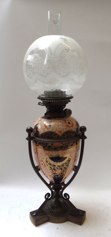 A Hinks no.2 oil lamp, late 19th century, the tapering ovoid Imari decorated pottery reservoir within a bronze frame, later shade and funnel, 83.5cm h