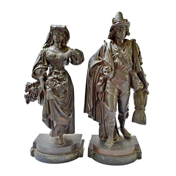 After Halou, a pair of 19th century bronze figures, modelled and cast as a lady with fruiting vines and her male companion with a sheath of corn, both