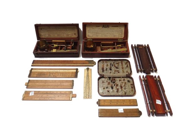 A brass pocket chondrometer, late 19th century, in a fitted mahogany case, together with a cased brass corn balance, a 19th century ivory sector, vari