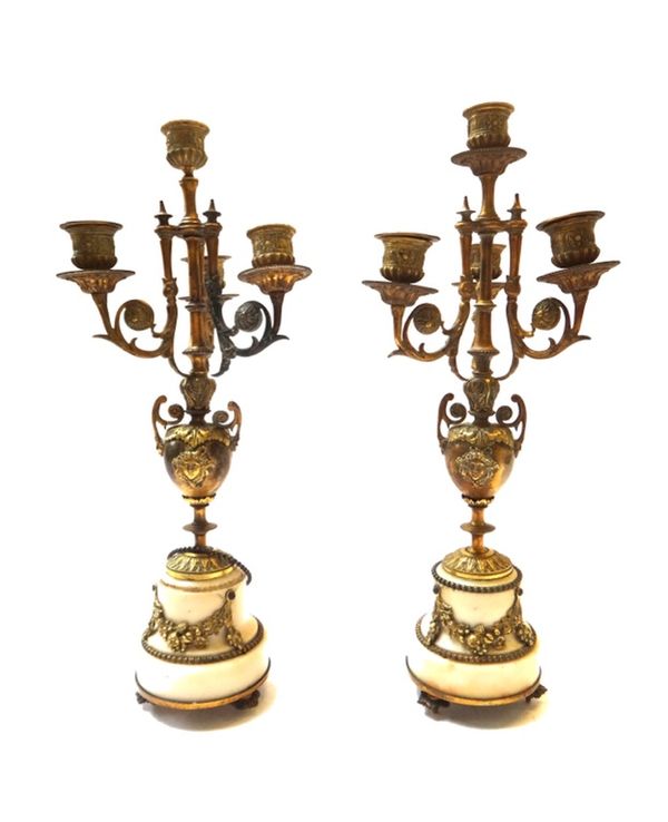 A pair of brass and marble mounted four branch candelabra, late 19th century, the four sconces over a two handled urn mount and circular stepped marbl