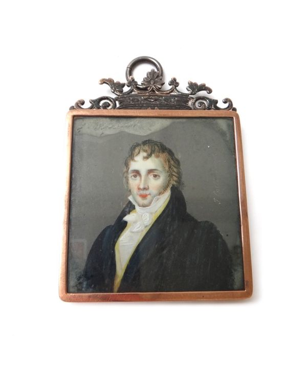 An early 19th century Continental portrait miniature on ivory of a gentleman, dark blue coat and yellow waistcoat, in an unmarked silver and gold colo