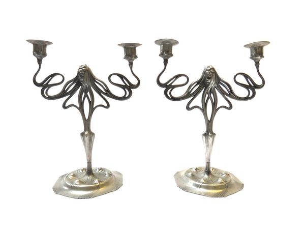 A pair of Orivit twin branch pewter figural candlesticks, early 20th century, each Art Nouveau maiden issuing two flowing branches, on a hexagonal foo