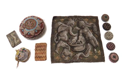 A beadwork sweethearts pin cushion detailed 'Forget Me Not', 16cm diameter, together with five circular beadwork boxes, a beadwork pin cushion and sun