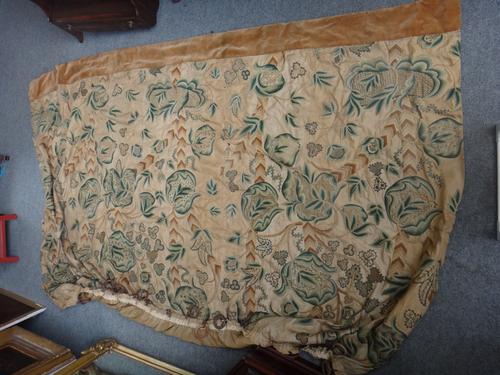 A crewel work curtain with green floral sprays, 170cm x 270cm.