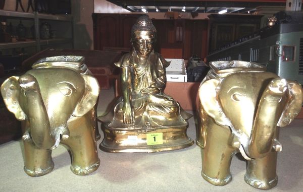 A polished bronze figure of a seated Buddha and a pair of brass elephants.