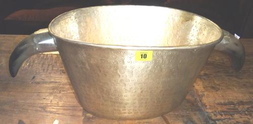 A white metal and cow horn wine cooler.