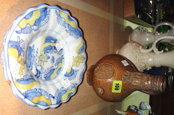 A Bellamine salt glaze pottery jug and a faience plate. (2)