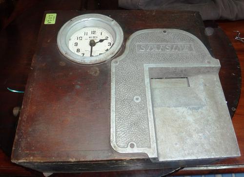 An early 20th century clocking in machine.