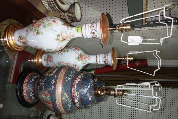 A group of six table lamps, including a pair of Oriental style blue baluster lamps, floral painted glass lamps and a pair of cast metal lamps.