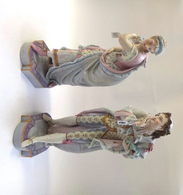 A pair of Continental biscuit porcelain figures, late 19th century, modelled as a gallant and companion, with green anchor mark, 56cm high (a.f). (2)