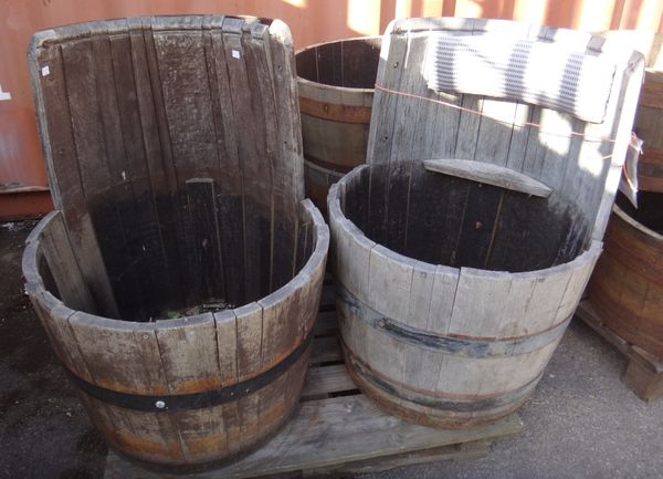 A pair of 20th century coopered barrels converted to garden seats.