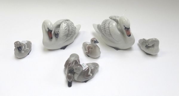 Six Royal Copenhagen porcelain wildfowl, comprising; two swans (359 and 360) and four cygnet groups (361, 362, 363 and 364), all boxed. (6)