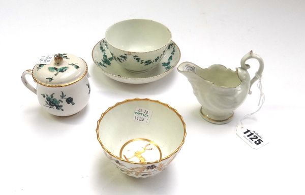 A Chelsea Derby teabowl and saucer, circa 1775, painted in green monochrome with flower swags suspended from a gilt dentil rim, gold D and anchor mark