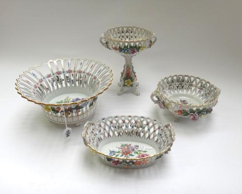 Four Potschappel (Carl Thieme) baskets, early 20th century, with blue printed monogram and Dresden marks, press-nummern, each painted with flowers and