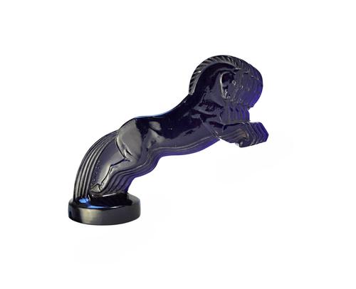 A Lalique glass car mascot cinq cheavaux, no.1122, circa 1925, irradiated blue (later coloured), moulded and etched mark 'R.LALIQUE FRANCE' (a.f.), 15