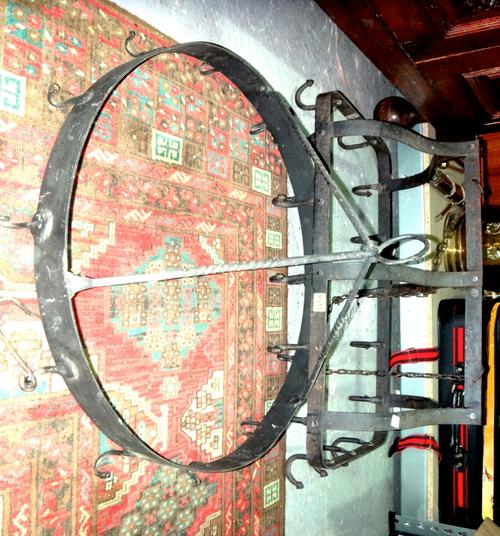 A large wrought iron hanging kitchen rack and another.