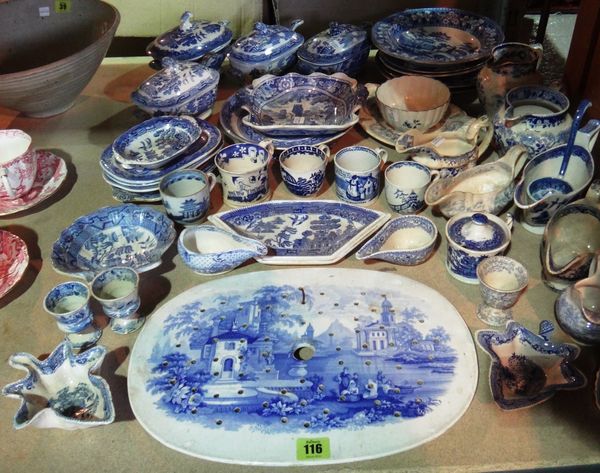 A quantity of 19th century and later blue and white transfer printed pottery, including plates, jugs, sauceboats, cups and sundry.