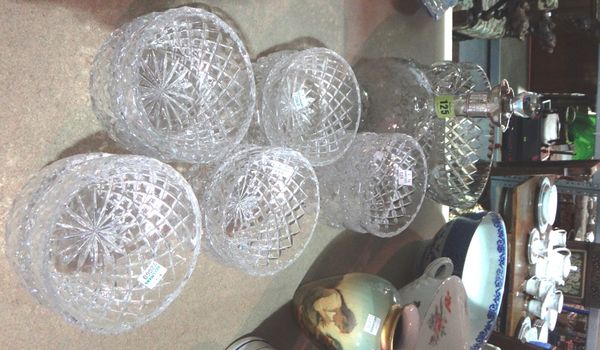 A group of cut glass bowls and a silver mounted decanter.