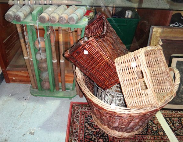 A group of five 20th century wicker and metal baskets together with a croquet set.