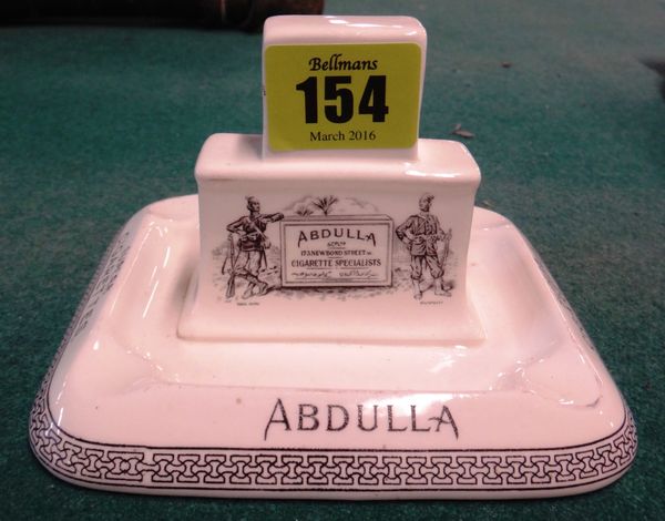A 1920's porcelain ashtray/matchbox holder advertising “Abdulla Superb Cigarettes- Pure No 75 Virginia”, 12.5cms wide