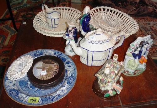 A quantity of ceramics including creamware baskets, Staffordshire figures, tea pot and sundry.