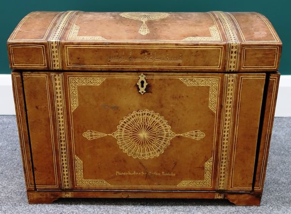 A 17th century style gilt tooled leather dome top trunk, with fitted interior and drop down front, 54cm wide.